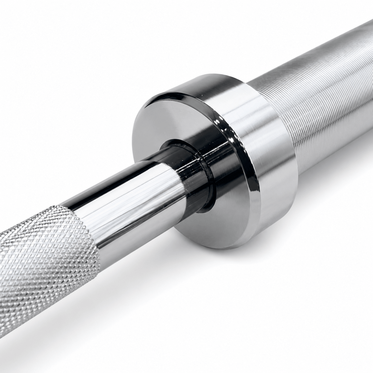Close-up of IRONBAY 7 ft Olympic barbell bronze bushing and chrome sleeve